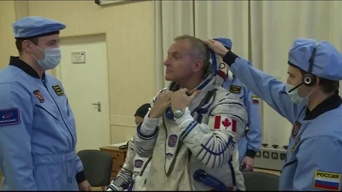 Soyuz MS-11 Expedition 58 Canadian Space Agency David Saint-Jacques suiting up Stock Footage 273697595