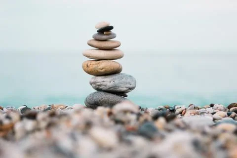 Spa and wellness background. Stack of pebble stones on the beach. 스톡 사진