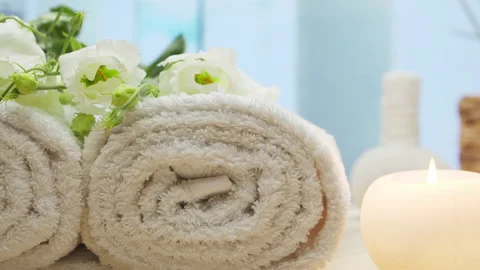 Spa background. Candles, flowers, massaging stones and herbal balls. Massage Stock Footage 230075563