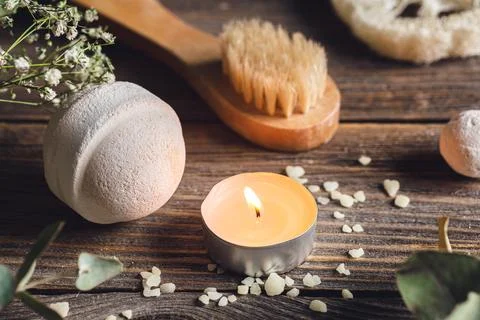 Spa composition with bath bomb, candle and dried flowers. Stock Photos