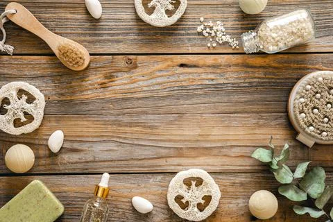 Spa composition with body care items on wooden background, top view. Stock Photos