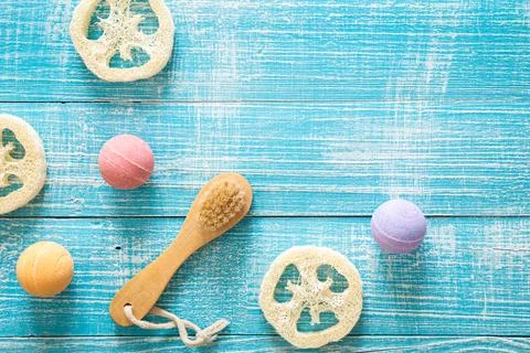 Spa composition with brush and bath bombs, flat lay. Stock Photos