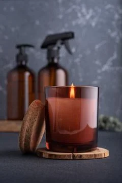 Spa composition with burning candle and recycled dispenser bottles for natura Stock Photos