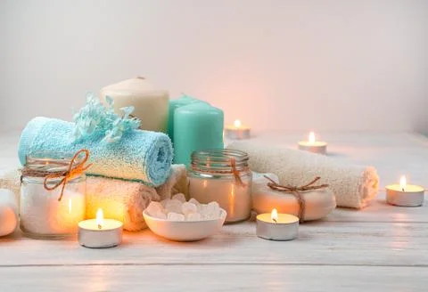 Spa composition with burning candles on a soft light background. Stock Photos