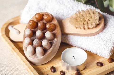 Spa composition with massage scrub soap and brush. Stock Photos