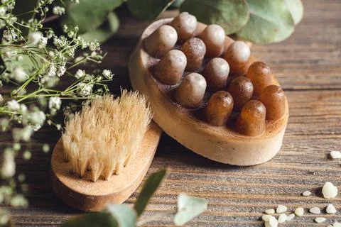 Spa composition with massage scrub soap and brush. Stock Photos
