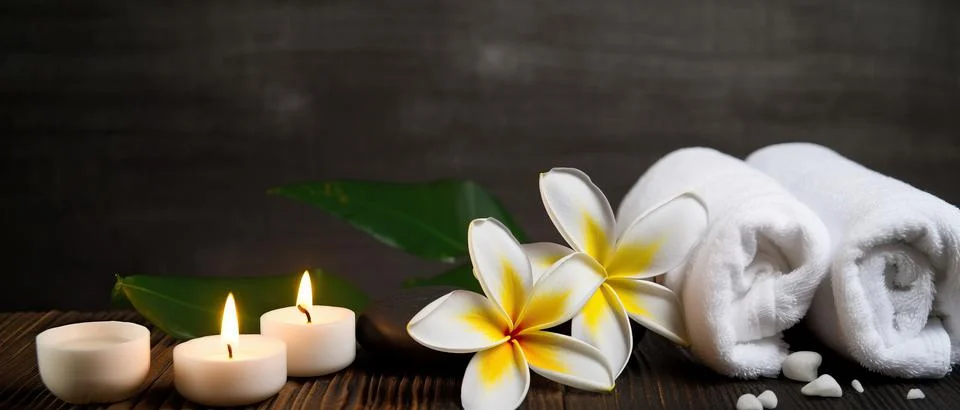 Spa composition on massage with Soft White Towels, Essential Oils, stones, .. Stock Photos