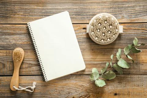 Spa composition with notepad and body care items, top view. Stock Photos