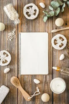 Spa composition with notepad and body care items, top view. Stock Photos