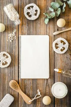 Spa composition with notepad and body care items, top view. Stock Photos