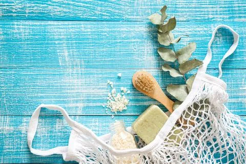 Spa composition with personal care items for body in a shopping bag, top view. Stock Photos