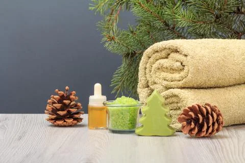 Spa composition with soft terry towel and spa products on wooden boards Stock Photos