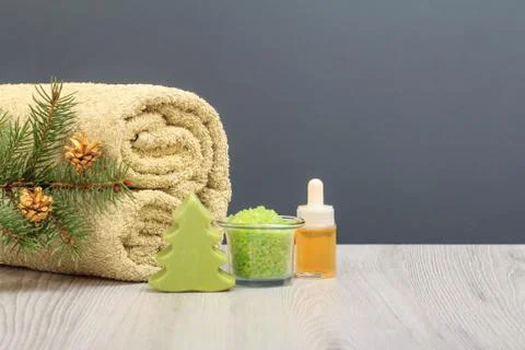Spa composition with soft terry towel and spa products on wooden boards Stock Photos