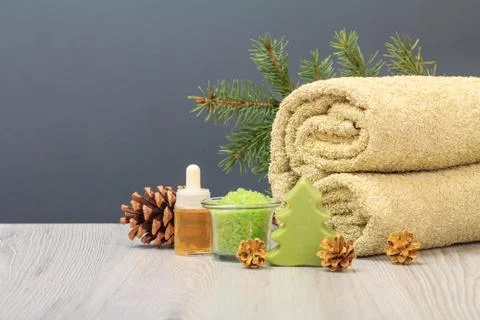 Spa composition with soft terry towel and spa products on wooden boards Stock Photos