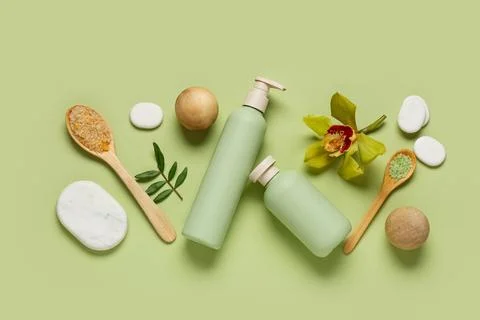 Spa composition with stones, spoon of sea salt and bottles of cosmetic produc Stock Photos