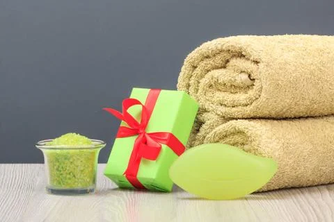 Spa composition with towel, gift box, sea salt and soap. Stock Photos