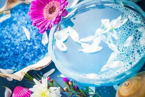 Spa composition water bath salt shells flowers Stock Photos