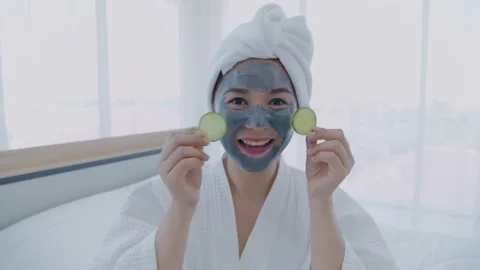 Spa concept of 4k Resolution. Asian girl is putting cucumbers on her eyes in  Stock Footage 145287750