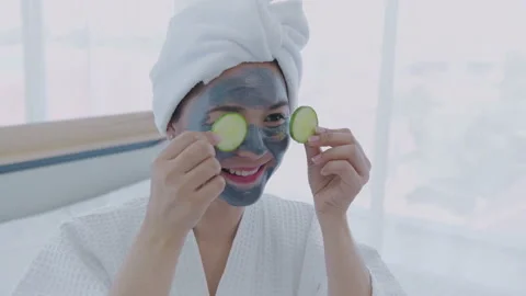 Spa concept of 4k Resolution. Asian girl is putting cucumbers on her eyes in  Stock Footage 154166448