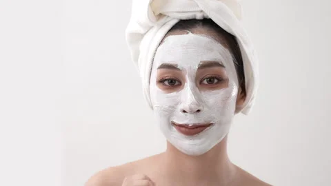 Spa concept of 4k Resolution. Asian woman applying facial cream in bedroom... Stock Footage 266729796