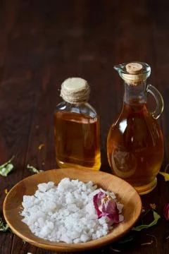 SPA concept: composition of spa treatment with natural sea salt, aromatic oil Stock Photos