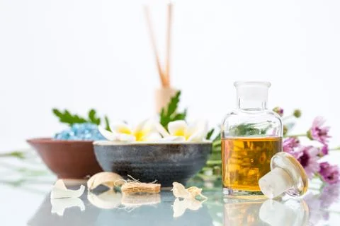 Spa concept with Floating Flowers, essential oil, and salt Стоковые фото