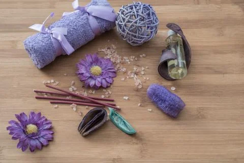 Spa concept. flowers,candles, aromatic salt,soap and bath purple towels Stock Photos