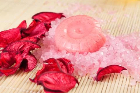 Spa concept: handmade soaps, petals and sea salt Stock Photos