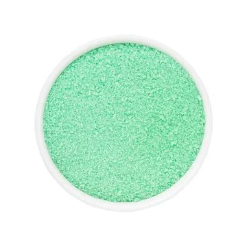 SPA concept. Mint green bath sugar in bowl isolated over white background with Stock Photos
