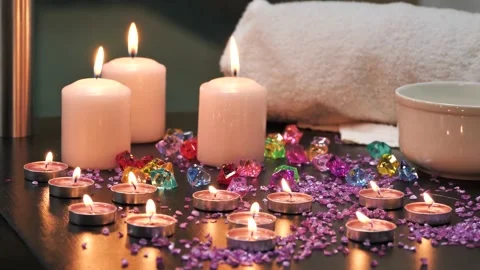 Spa decor, burning candles, decorative stones and towel Stock Footage 164534156