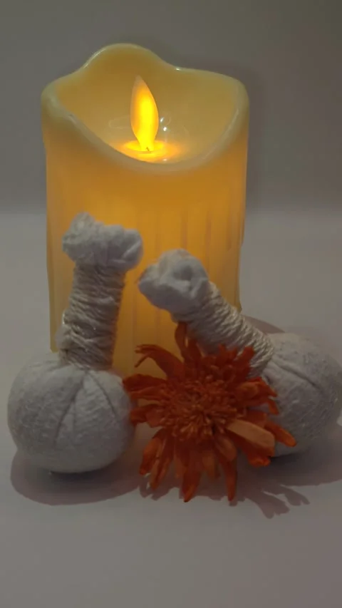 Spa decor close-up and candles flickering and glare macro photography Stock Footage 325051011