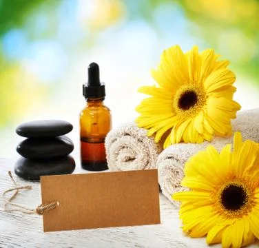 Spa elements with card over shiny leaves light Stock Photos