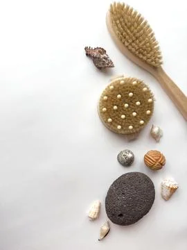 Spa essentials on white background with natural brushes and seashells Foto stock