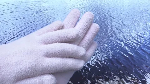 Spa gel moisturizing gloves on blue wave background. Stock Footage 156451252