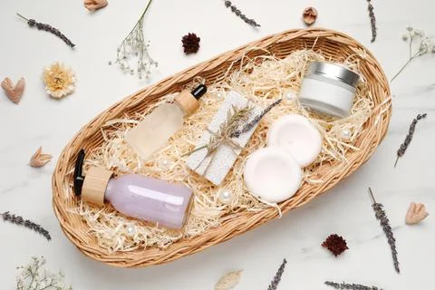 Spa gift set with different personal care products on white marble table, fla Stock Photos