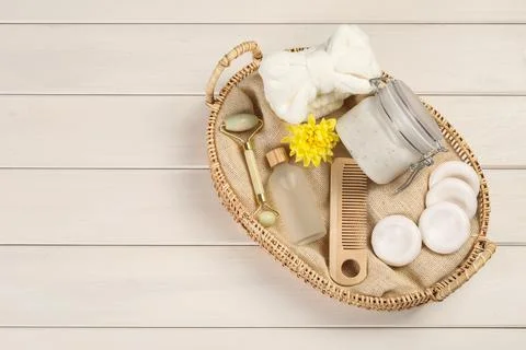 Spa gift set with different products in wicker basket on white wooden table,  Stock Photos