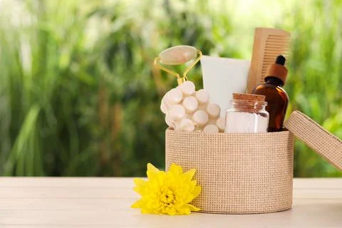Spa gift set with different products on white wooden table against blurred .. Stock Photos