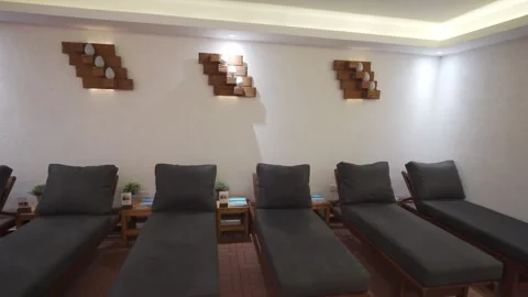 Spa lounge interior with rows of empty chairs, serene ambiance for relaxation Stock Footage 270422561