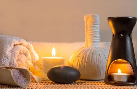 Spa massage setting with candlelight Stock Photos