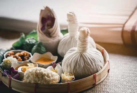 Spa massage wellness decorations setting on wood table. Thai spa massage tr.. Stock Photos