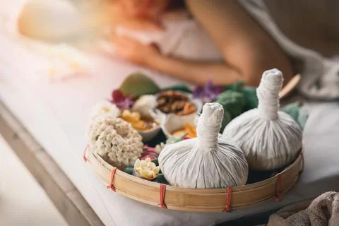 Spa massage wellness decorations setting on wood table. Thai spa massage tr.. Stock Photos