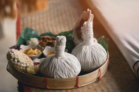 Spa massage wellness decorations setting on wood table. Thai spa massage tr.. Stock Photos