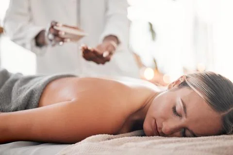 Spa, oil and woman on a table for massage, wellness and skin treatment for peace Stock Photos
