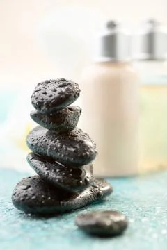 Spa or Wellness background with a stack of massage stones. Stock Photos