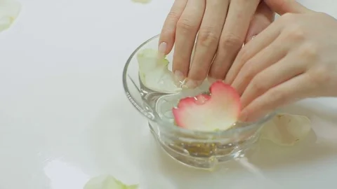 Spa Procedure. Woman In Beauty Salon Holding Fingers In Aroma Bath For Hands. Stock Footage