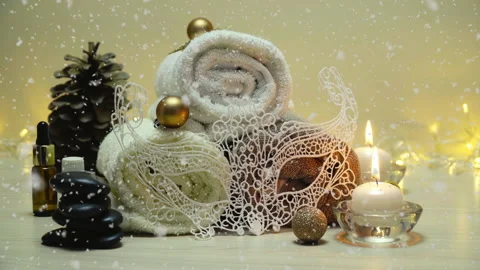 Spa salon items and attributes with christmas decorations in mild snowfall Stock-Footage 143351114