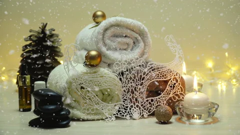 Spa salon items and attributes with christmas decorations in mild snowfall Stock-Footage 143524324