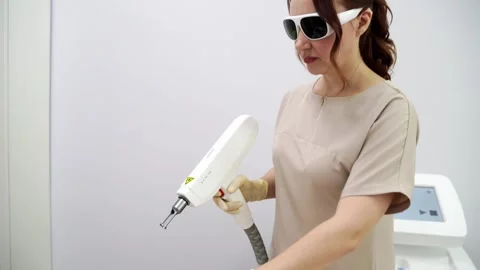 A spa session features a rejuvenating carbon laser facial. The treatment various Stock Footage 278533460