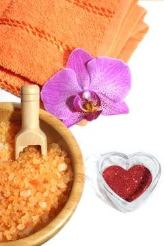 Spa set from orange bath salt, towel with orchid flower and red heart on Val Stock Photos