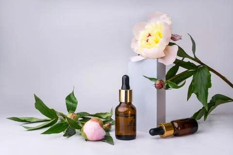 Spa set with peony flowers mortar and essential oil Stock Photos